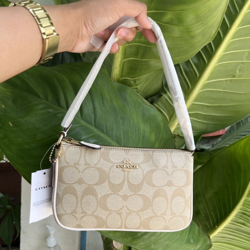 coach signature nolita