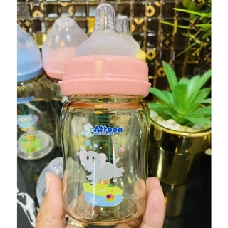 Newขวดนมคอกว้างสีชาATTOON 4zo.8zo.มาพร้อม จุกนมคุมการไหลมาตราฐานด้วยปริมาณรูป้องกันการเกิดโคลิค
