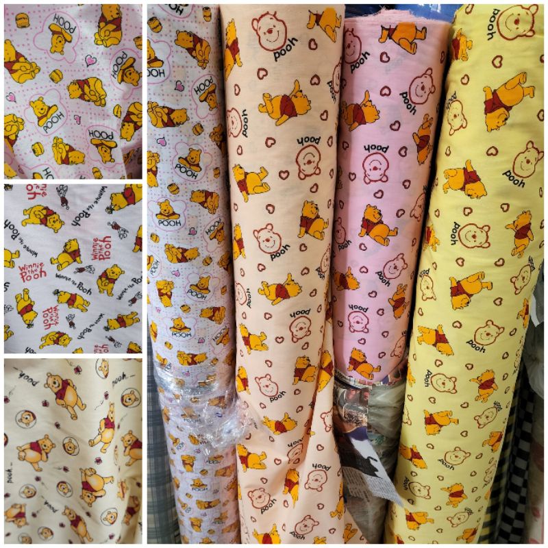 ผ้าคอตตอนทีซี ลายการ์ตูน หมีพลู pooh แคร์แบร? หน้ากว้าง 110-115cm