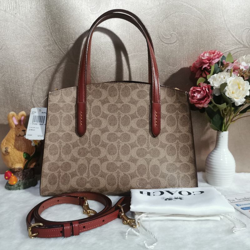 COACH 32749 CHARLIE CARRYALL 28 IN SIGNATURE CANVASCOLOR: B4/RUST
