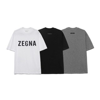 เสื้อยืดแขนสั้น คอกลม ทรงหลวม พิมพ์ลายตัวอักษร ZEGNA สําหรับผู้ชาย และผู้หญิง