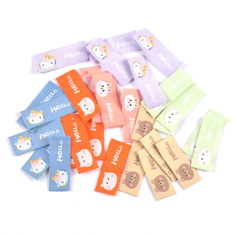 50 ชิ้นสัตว์น่ารัก "สวัสดี "จดหมายเย็บปักถักร้อยป้ายผ้าสําหรับเด็ก DIY เสื้อผ้างานฝีมือ DIY อุปกรณ์อุปกรณ์เย็บผ้าแท็ก CP3503
