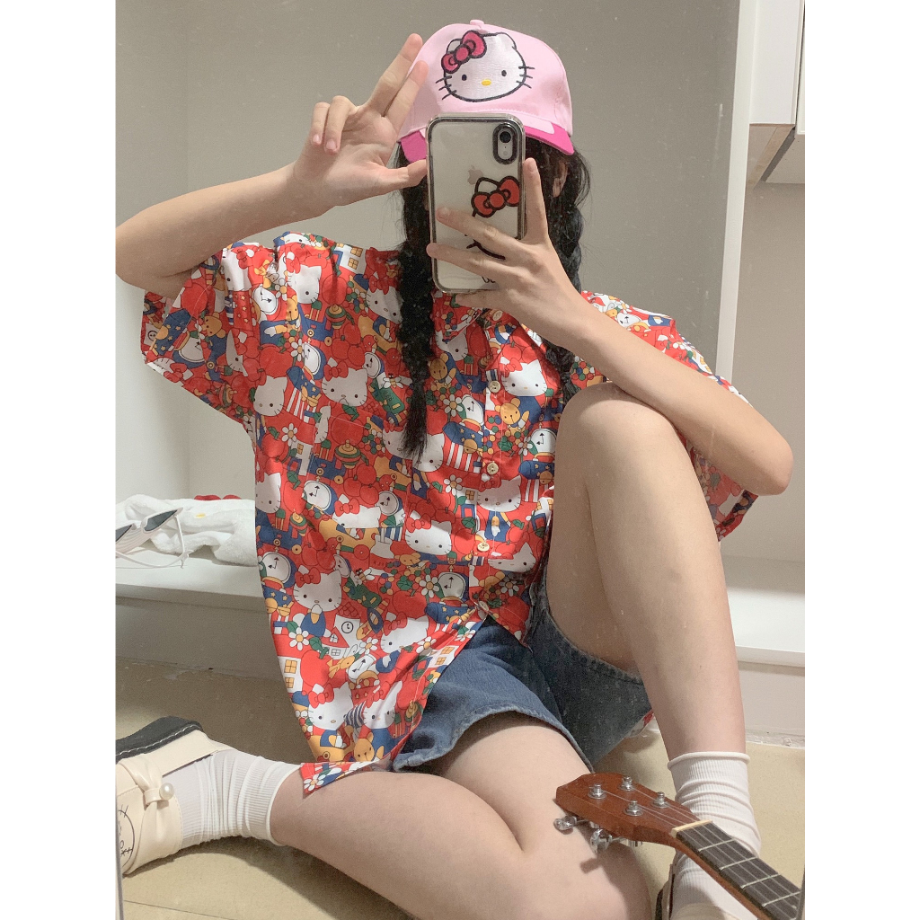 เสื้อเชิ้ตแขนสั้น พิมพ์ลายการ์ตูนเฮลโลคิตตี สไตล์วินเทจ ฮาวาย ใส่ริมทะเล ไม่ซ้ําใคร สําหรับผู้ชาย และผู้หญิง