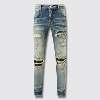 High Street AMIRI Jeans แฟชั่นผู้ชายกางเกงยีนส์วินเทจสีฟ้าผอมฉีกหนังแพทช์ผู้ชายฮิปฮอปแบรนด์กางเกงยีนส์