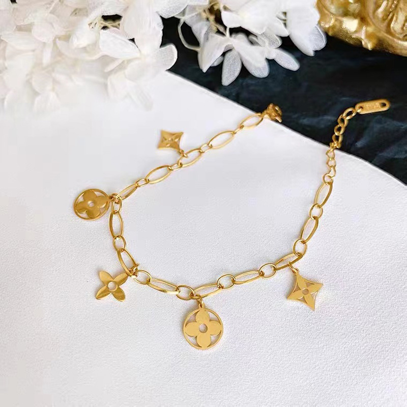 Ht สร้อยข้อมือสเตนเลส ไทเทเนียม ทอง 18K รูปใบโคลเวอร์สี่แฉก กลวง ไม่จางหาย หรูหรา เครื่องประดับ สําหรับผู้หญิง