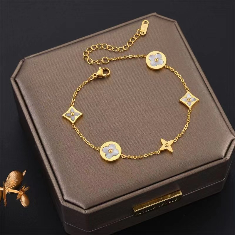 HT ห้าดอกไม้โคลเวอร์สี่ใบสร้อยข้อมือเหล็กไทเทเนียมผู้หญิงแฟชั่นสแตนเลส18เคเครื่องประดับทอง