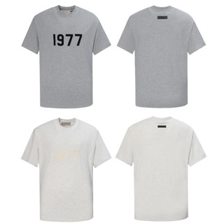 ใหม่ เสื้อยืดแขนสั้น พิมพ์ลายตัวเลข 1977 สไตล์สตรีท อเมริกัน ไฮสตรีท แฟชั่น สําหรับทุกเพศ