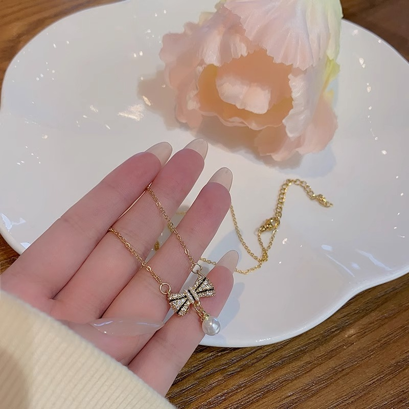 เครื่องประดับ สร้อยคอ ประดับโบว์ และไข่มุก สีทอง คุณภาพสูง เหมาะกับของขวัญวันเกิด สไตล์เกาหลี สําหรับผู้หญิง และนักเรียน - รูปที่ 3