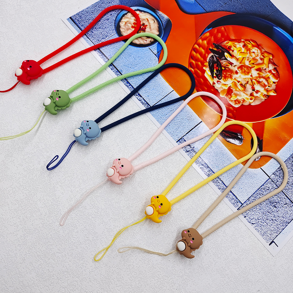 สายรัดข้อมือซิลิโคน ป้องกันการสูญหาย รูปไดโนเสาร์น่ารักมาก สีแคนดี้ สําหรับโทรศัพท์มือถือ