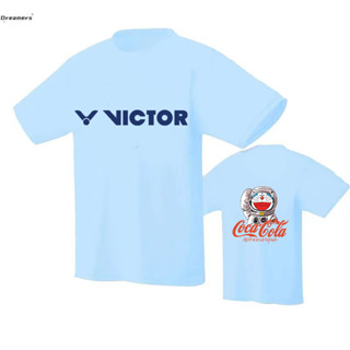 เสื้อกีฬาปิงปอง พิมพ์ลายการ์ตูนโดราเอมอน แบบแห้งเร็ว ดูดซับเหงื่อ ระบายอากาศได้ดี สวมใส่สบาย สําหรับผู้ชาย และผู้หญิง