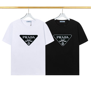 เสื้อยืดแขนสั้น คอกลม ผ้าฝ้าย ปักลาย Prad แฟชั่นสําหรับผู้ชาย และผู้หญิง