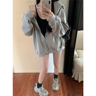 Grey long sleeved hooded sweater jacket for women in autumn loose casual zippered top with a tank top underneath