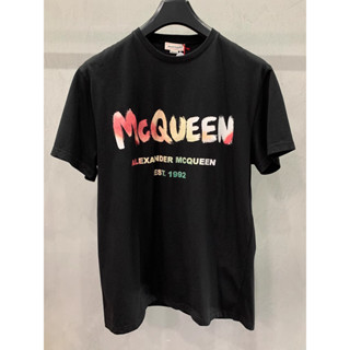 Mcq ใหม่ ขายดี เสื้อยืดแขนสั้น ผ้าฝ้ายแท้ พิมพ์ลาย สําหรับผู้ชาย และผู้หญิง