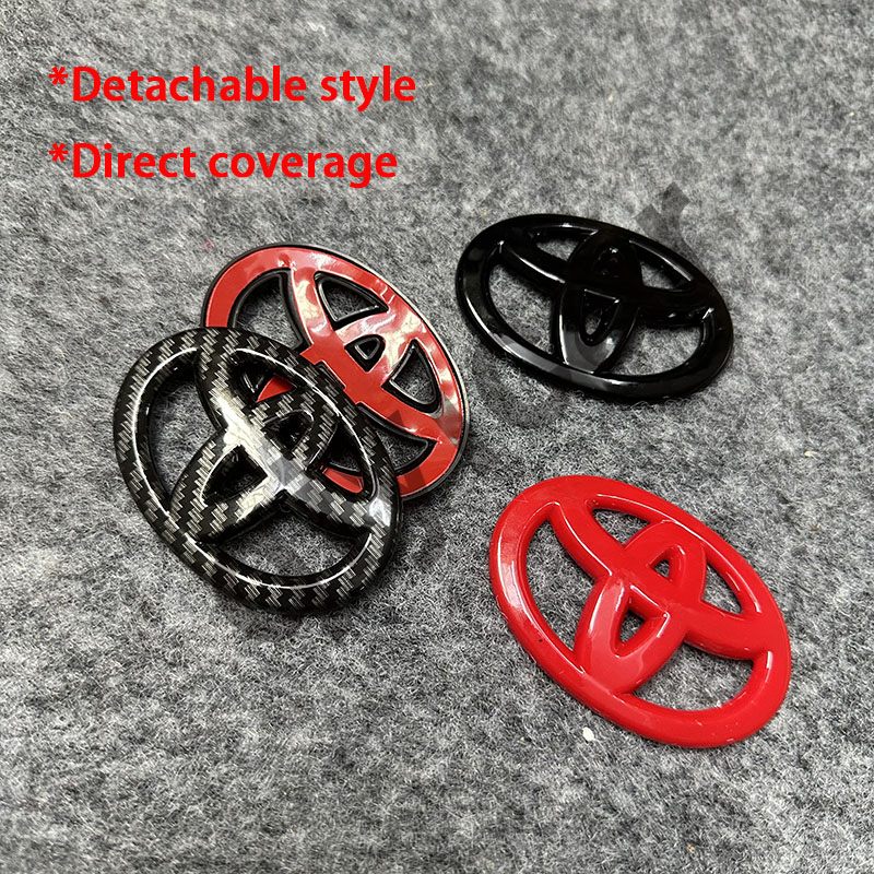 เหมาะสําหรับ Toyota Yize Camry ป้ายสีดํา Elfa รมควัน Ruizhi พวงมาลัยโลโก้ด้านหน้าสีดําด้านหลังคาร์บอนไฟเบอร์