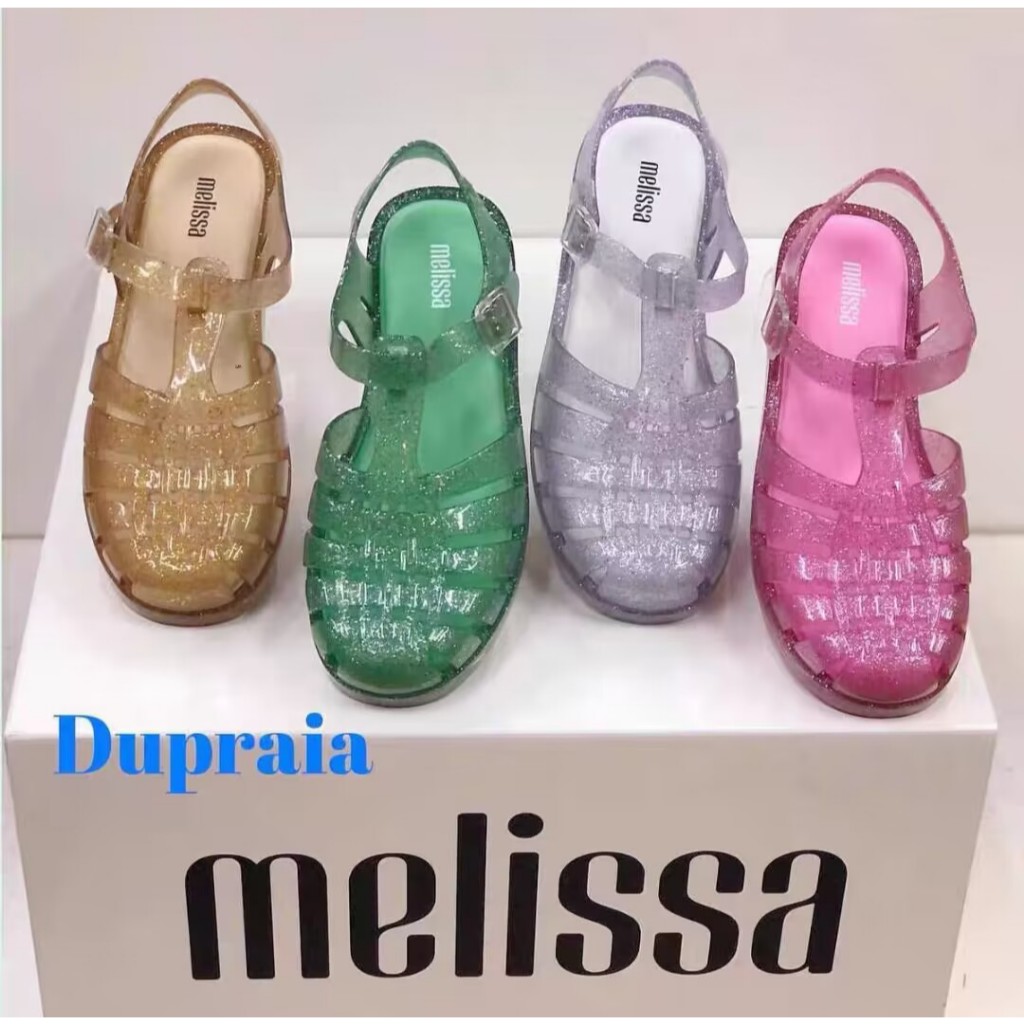 2025 สไตล์ใหม่ Melissa รองเท้าแตะผู้หญิง Baotou Hollow รองเท้าเจลลี่แบนรองเท้าชายหาดกันลื่น