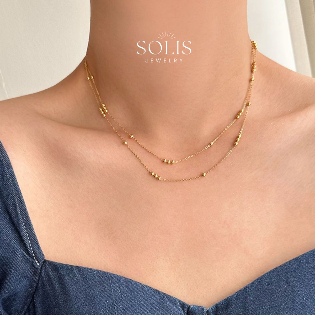 SOLIS สร้อยคอโซ่เงินลูกปัดทอง 2 ชั้น • กันน้ำไม่ทำให้เสื่อมเสียเครื่องประดับ • ชุบทอง 18K 316L สแตนเลสไทเทเนียมสร้อยคอเหล็กสำหรับผู้หญิงผู้ชาย NL184