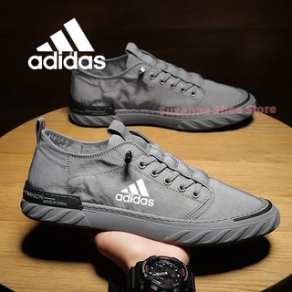 พร้อมสต็อก สไตล์สีเทาผู้ชายรองเท้าผ้าใบรองเท้าลําลองแบนรองเท้ากีฬารองเท้าวิ่ง
