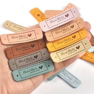20 ชิ้น 5.5x1.5 ซม.หัวใจ Handmade นูน PU ป้ายหนังสําหรับอุปกรณ์เย็บผ้าล้างทําความสะอาดได้ Care กระเป๋าเสื้อผ้า DIY วัสดุแท็ก CP3299