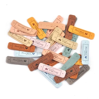 20 ชิ้น 5.5x1.5 ซม.หัวใจ Handmade นูน PU ป้ายหนังสําหรับอุปกรณ์เย็บผ้าล้างทําความสะอาดได้ Care กระเป๋าเสื้อผ้า DIY วัสดุแท็ก CP3299