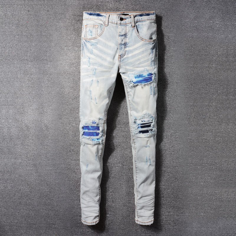 Amiri High Street แฟชั่นผู้ชายกางเกงยีนส์วินเทจสีฟ้าอ่อนหลุมสีฟ้าประกบฝีมือการออกแบบปุ่มคุณภาพสูงผู้ชายกางเกงยีนส์ผอม