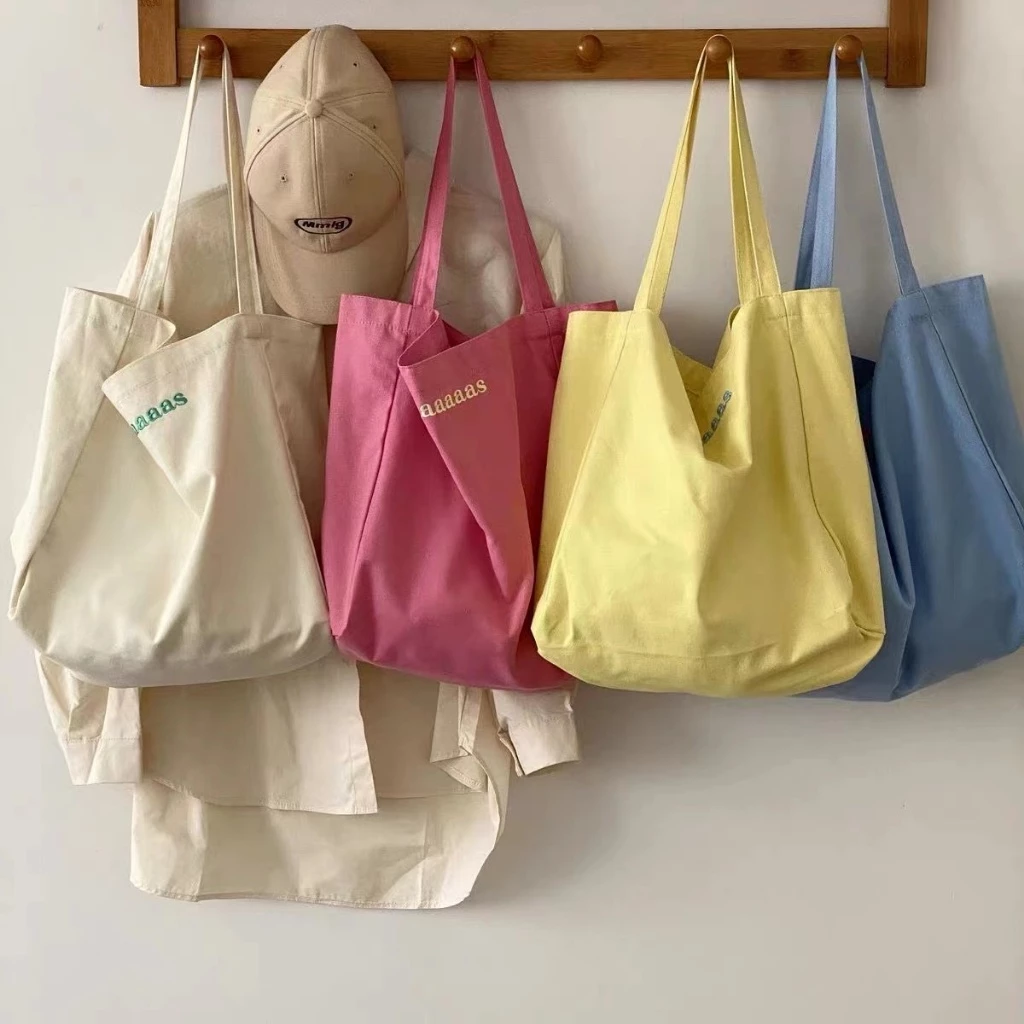 【จัดส่งจากประเทศไทย】🌼พร้อมส่ง🌼 กระเป๋าผ้าใบ สะพาย ความจุสูง ins กระเป๋าผ้า ผ้าลายการ์ตูน