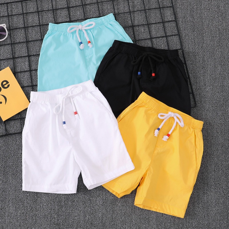 กางเกงขาสั้นสีขาวเด็กผู้ชายกางเกงขาสั้นผ้าฝ้ายหลวมกีฬากางเกงขาสั้นโจรสลัด