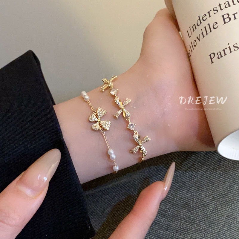 DREJEW สร้อยข้อมือ ประดับโบว์ เพทาย ทอง 18K แฟชั่นเกาหลี มุก ดึงออก หรูหรา และอเนกประสงค์ เครื่องประดับมือ