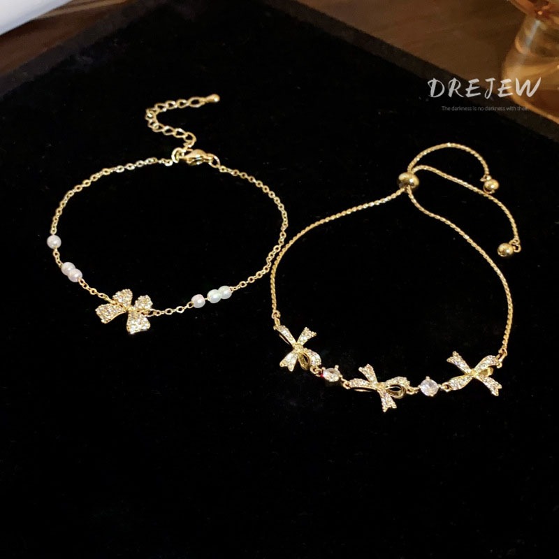 DREJEW สร้อยข้อมือ ประดับโบว์ เพทาย ทอง 18K แฟชั่นเกาหลี มุก ดึงออก หรูหรา และอเนกประสงค์ เครื่องประดับมือ