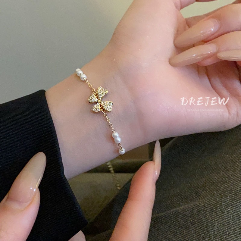DREJEW สร้อยข้อมือ ประดับโบว์ เพทาย ทอง 18K แฟชั่นเกาหลี มุก ดึงออก หรูหรา และอเนกประสงค์ เครื่องประดับมือ