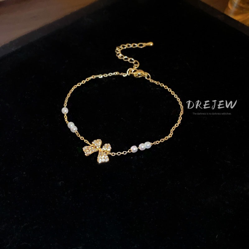DREJEW สร้อยข้อมือ ประดับโบว์ เพทาย ทอง 18K แฟชั่นเกาหลี มุก ดึงออก หรูหรา และอเนกประสงค์ เครื่องประดับมือ