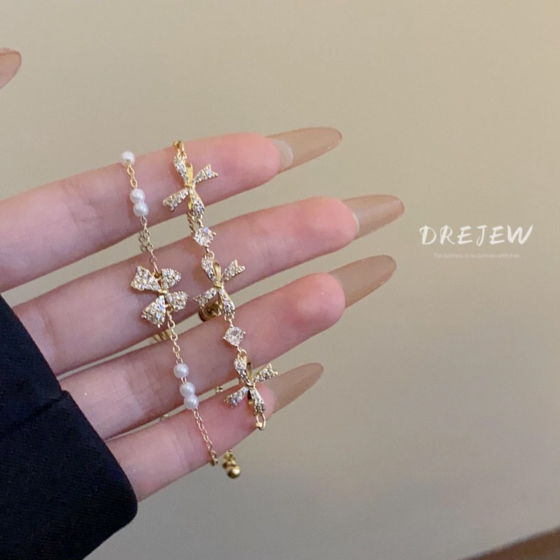 DREJEW สร้อยข้อมือ ประดับโบว์ เพทาย ทอง 18K แฟชั่นเกาหลี มุก ดึงออก หรูหรา และอเนกประสงค์ เครื่องประดับมือ
