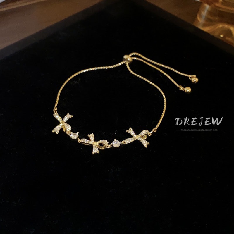 DREJEW สร้อยข้อมือ ประดับโบว์ เพทาย ทอง 18K แฟชั่นเกาหลี มุก ดึงออก หรูหรา และอเนกประสงค์ เครื่องประดับมือ