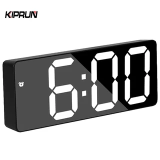 Kiprun นาฬิกาปลุกดิจิทัล LED ควบคุมด้วยเสียง ฟังก์ชั่นเลื่อนปลุก 12 24H ปรับความสว่างได้ 3 ระดับ โหมดปลุก 3 โหมด สําหรับบ้าน ห้องนอน สํานักงาน