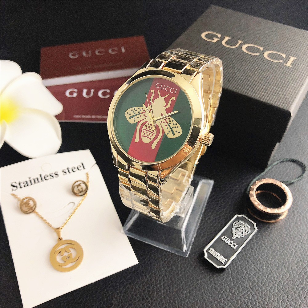 Gucci GUCCl Gucci G-Timeless Series นาฬิกาข้อมือควอตซ์สายสแตนเลสหน้าปัดสแตนเลสนาฬิกาผู้หญิงพระคัมภีร