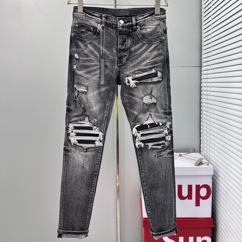 Amiri High Street แฟชั่นผู้ชายกางเกงยีนส์วินเทจสีเทาบางพอดีหนังสีดำประกบแพทช์ฝีมือคุณภาพดีผู้ชายสไตล์ฮิปฮอปกางเกงยีนส์