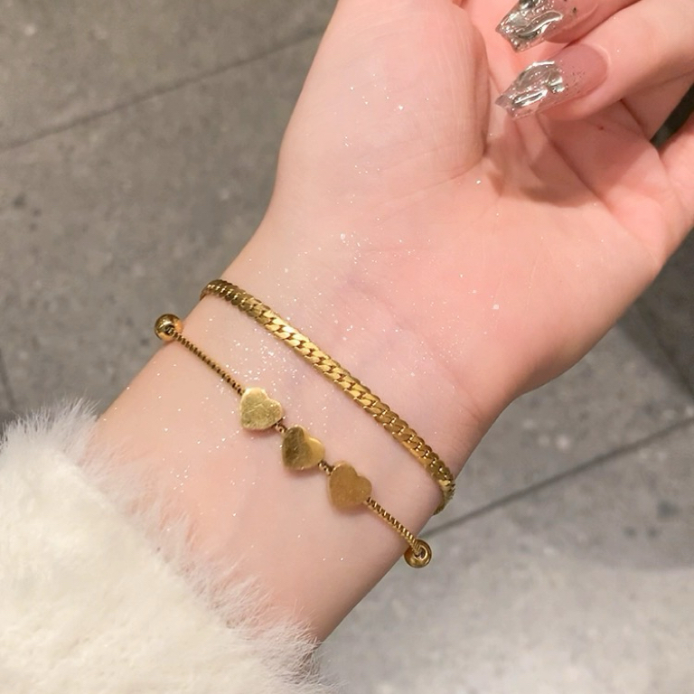 คู่รักทำมือไทเทเนียมโลหะผสมผู้หญิงสไตล์ใหม่ทำมือหรูหรากระดูกงูทำมือนิชทำด้วยมือประณีตเชือกงานฝีมือ