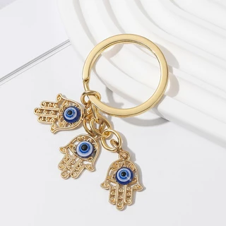 Gmai Blessed Evil Eye พวงกุญแจปาล ์ มผีเสื ้ อ Lucky Amulet ป ้ องกันพวงกุญแจสําหรับกระเป ๋ าอุปกรณ ์ เสริมของขวัญเครื ่ องประดับ