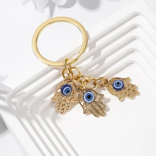 Gmai Blessed Evil Eye พวงกุญแจปาล ์ มผีเสื ้ อ Lucky Amulet ป ้ องกันพวงกุญแจสําหรับกระเป ๋ าอุปกรณ ์ เสริมของขวัญเครื ่ องประดับ
