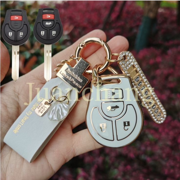 เคสกุญแจรถยนต์ TPU พร้อมพวงกุญแจ สีทอง สําหรับ Nissan Livina March Sunny Sylphy Tiida