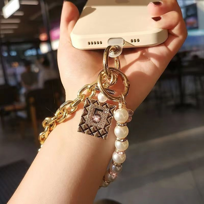 เชือกเส้นเล็กโทรศัพท์มือถือสร้อยข้อมือมุกสั้นสุภาพสตรีสายรัดข้อมือเชือกเส้นเล็กโทรศัพท์มือถือ