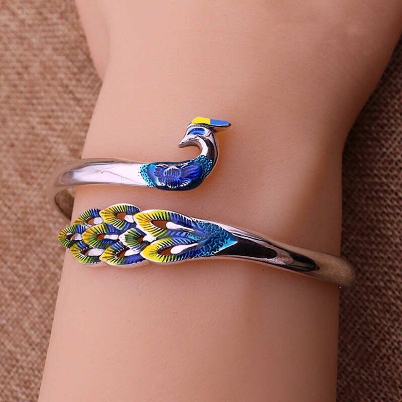 ย้อนยุคสไตล์ชาติพันธุ์ Cloisonne ทาสีชุบเงินนกยูงน้ํามันหยดสร้อยข้อมือประณีตแฟชั่นเงินไทยกลวงฟีนิกซ์สร้อยข้อมือ