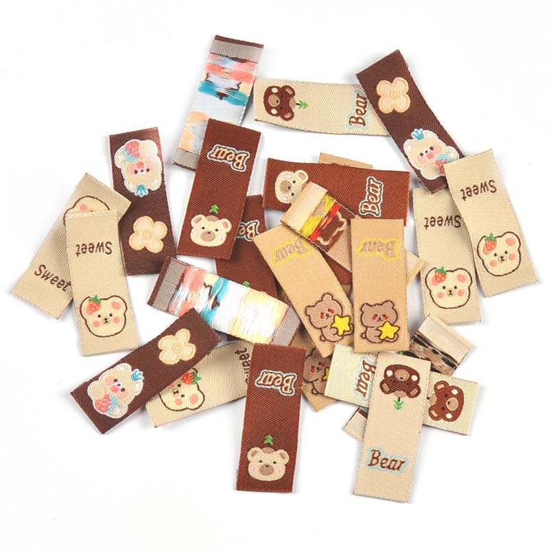 50 ชิ้น 40x15 มิลลิเมตรหมีสีน้ําตาล Series ป้ายสําหรับอุปกรณ์เย็บผ้า DIY เสื้อผ้าหัตถกรรมเสื้อผ้าแท็กหมวกตกแต่ง Handmade อุปกรณ์ CP3576
