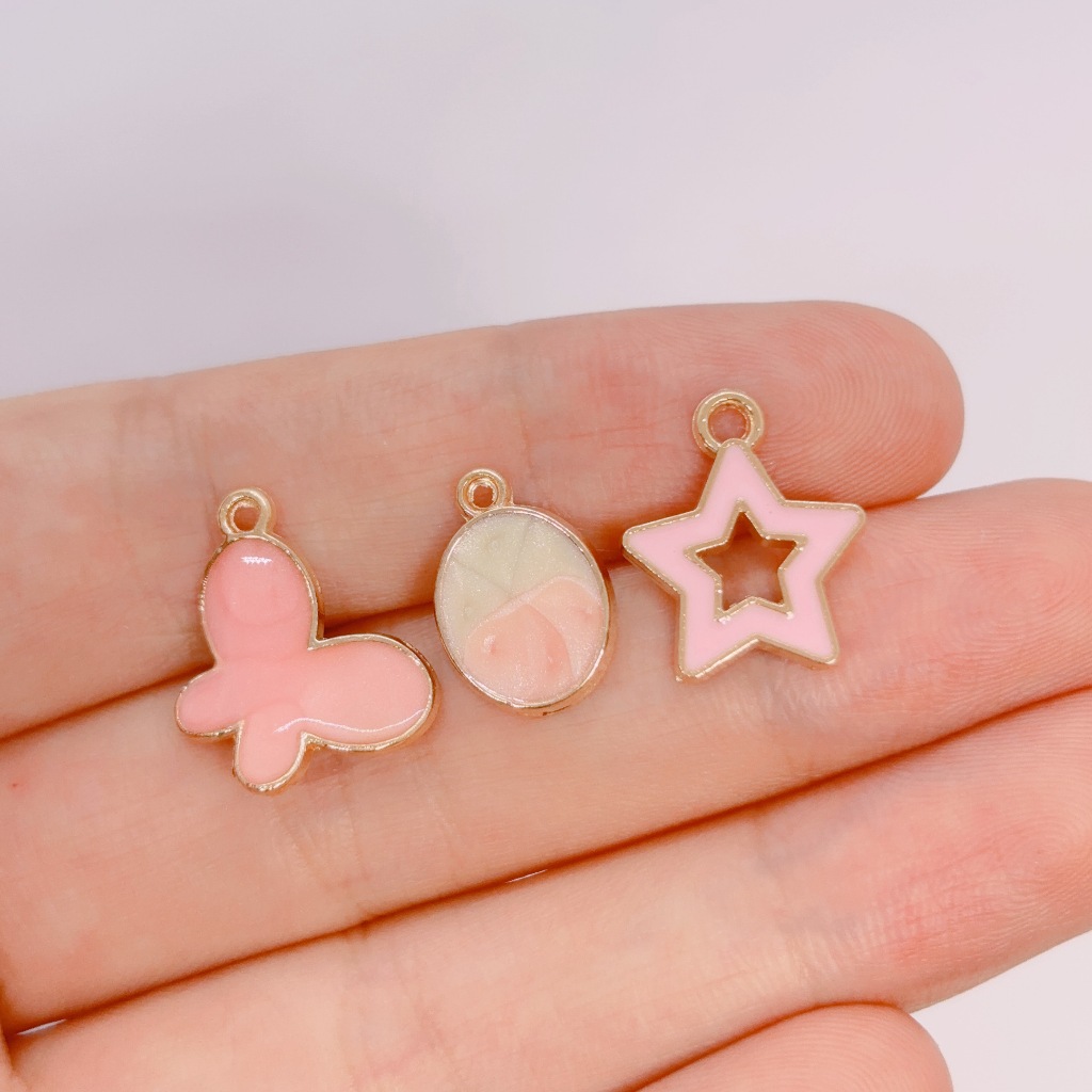 4ชิ้นสีชมพูผีเสื้อดาวจี้เคลือบโลหะเสน่ห์สร้อยคอสร้อยข้อมือเครื่องประดับ ทําเอง ทําอุปกรณ์เสริม