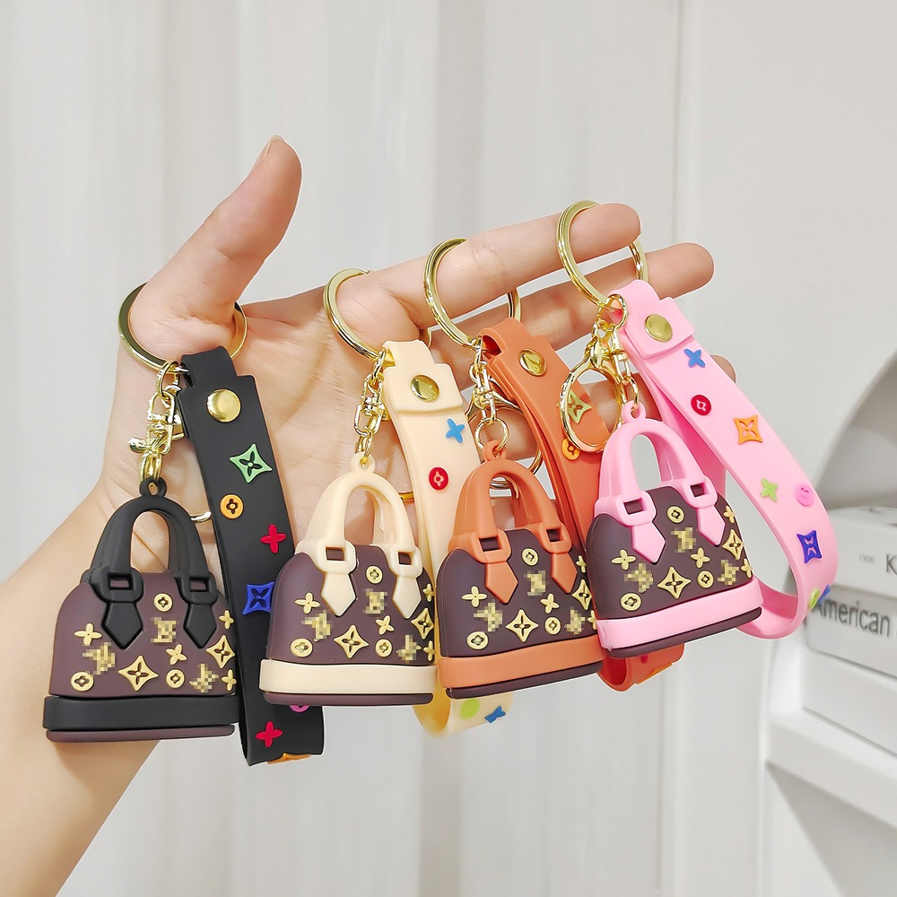 Cross-border Hot สไตล์การ์ตูน LV Mini Bag พวงกุญแจสาวแฟชั่น L ซองเล็กพวงกุญแจรถจี้
