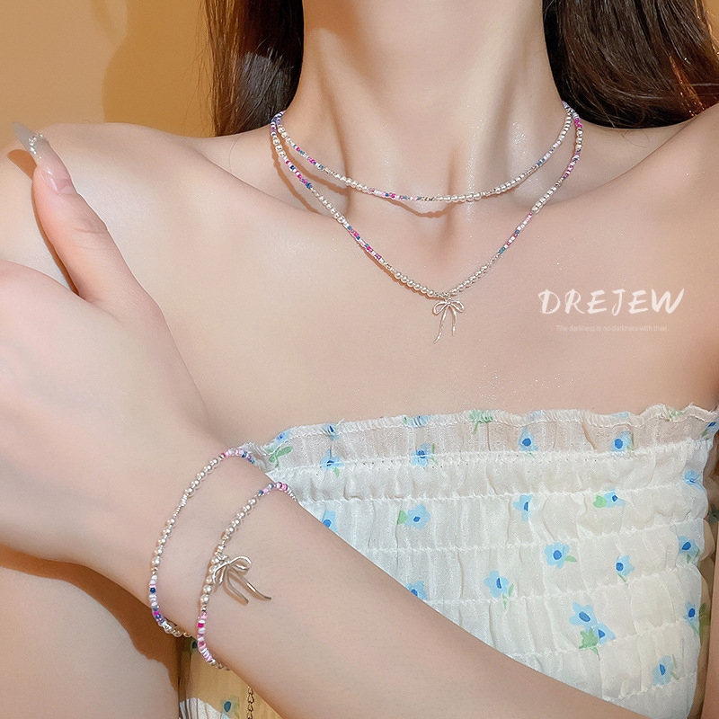 DREJEW เดรช โบว์โบว์ข้าวลูกปัดหักสร้อยคอเงินสร้อยข้อมือแฟชั่นอารมณ์ซอกกระดูกไหปลาร้าโซ่ส่วนบุคคลอเนกประสงค์สร้อยคอเครื่องประดับมือ