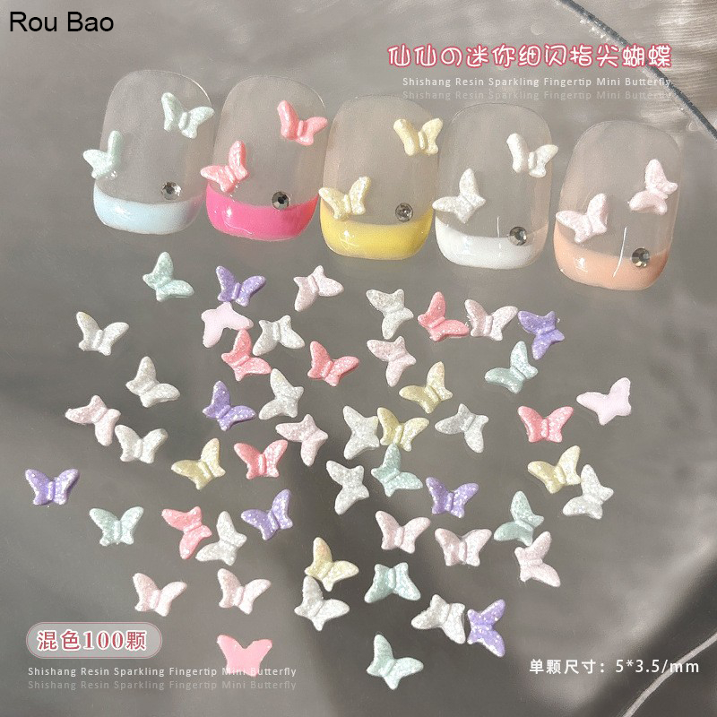 Rou Bao 100 ชิ้นเล็บมินิผีเสื้อโบว์ที่มีสีสัน Glitter เรซิ่น Girly เล็บตกแต่งศิลปะ