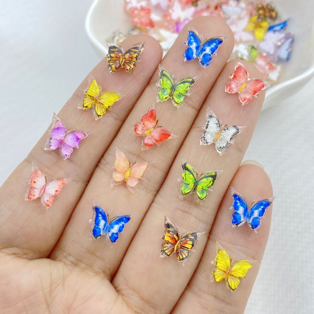 ขายร้อนตกแต่งเล็บน่ารักสีสันมินิผีเสื้อ 3D ขนาดเล็กหลากสี DIY 50 ชิ้น