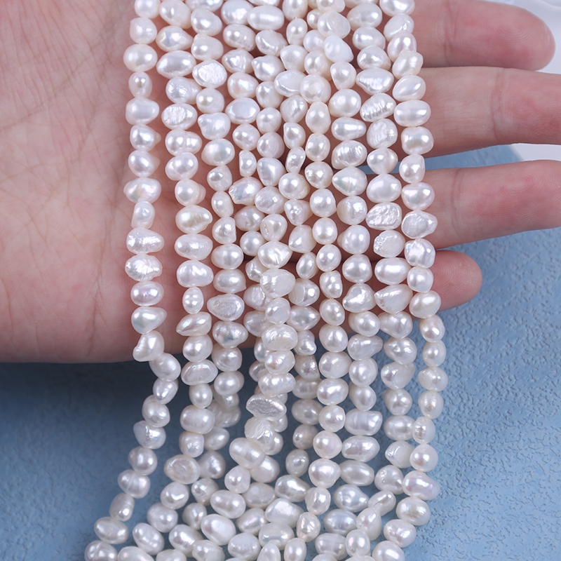 18 ซม. 5-6 มม. สีขาวเส้นมุกพิสดารน้ําจืดธรรมชาติสําหรับทําเครื่องประดับ