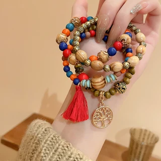 สร้อยข้อมือลูกปัดไม้จันทน์หลายชั้นสไตล์โบฮีเมียนย้อนยุคสร้อยข้อมือสไตล์แห่งชาติแสงหรูหราอารมณ์ความรู้สึกอาวุโสเครื่องประดับมือผู้ห