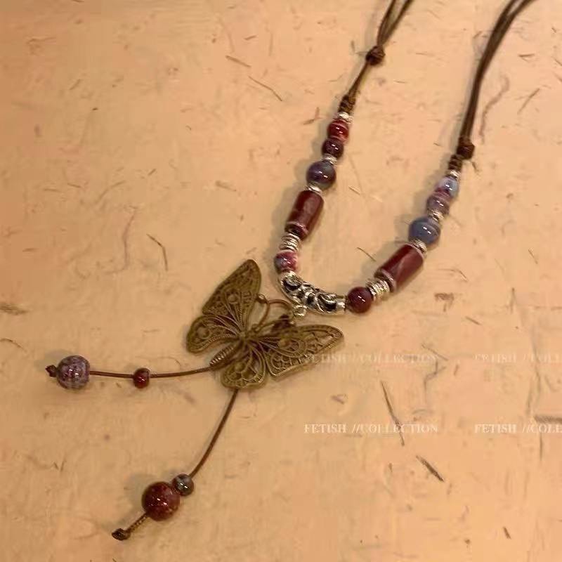 ใหม่สไตล์จีนเซรามิคสร้อยคอผีเสื้อผู้หญิงฤดูร้อนหรูหรา Niche Retro Clavicle Chain สไตล์ชาติพันธุ์ยาวเสื้อกันหนาวอุปกรณ์เสริม